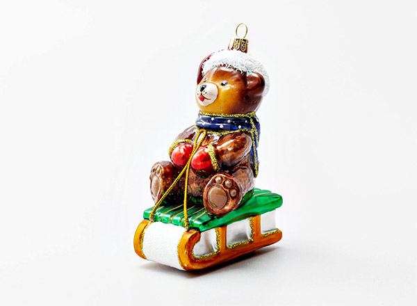 Christmas tree toy Teddy bear on a sled