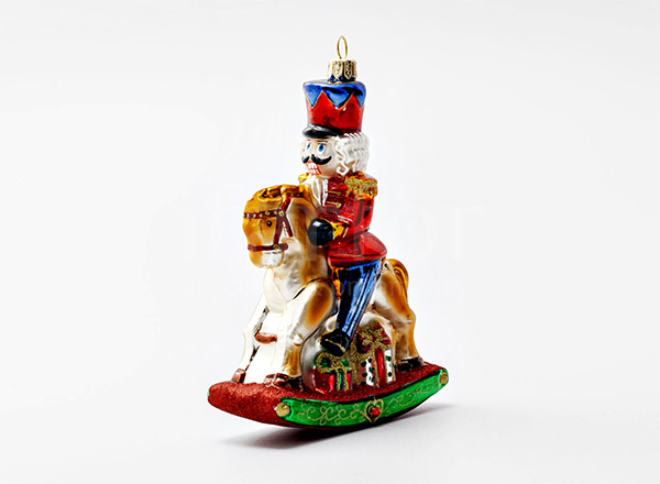 Christmas tree toy Nutcracker on a rocking horse