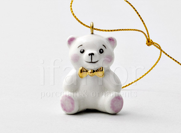 Christmas tree toy Teddy bear with a gold bow