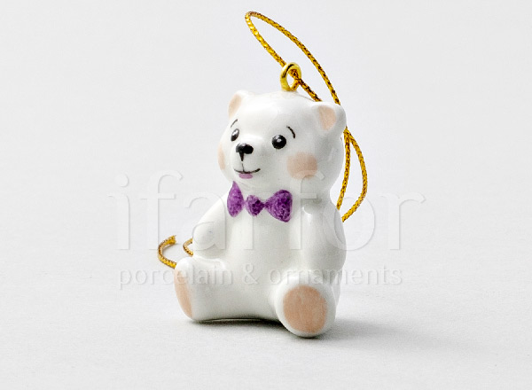 Christmas tree toy Teddy bear with a purple bow
