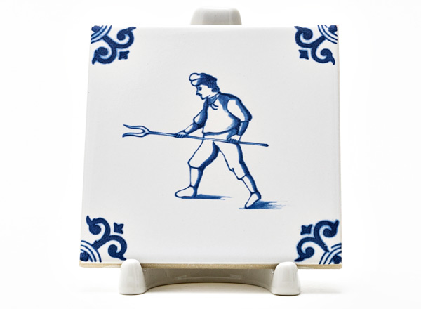 Tile Dutch. Peasant with a fork 