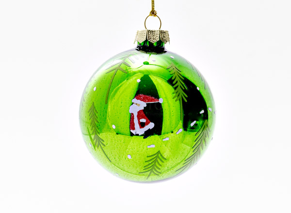 Christmas tree toy Christmas ball Green. Santa Claus in the forest